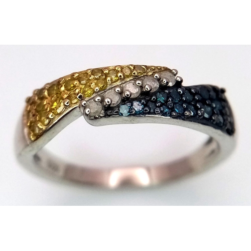 977 - A Sterling Silver Three Colour Diamond Set Ring Size O. The Ring is set with Clear, Yellow and Blue ... 