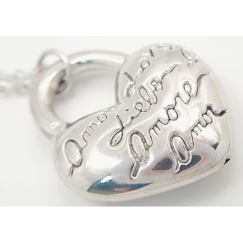 1052 - A STERLING SILVER NECKLACE WITH HEART PENDANT ENGRAVED WITH THE WORD LOVE IN MANY LANGUAGES 9.8G. Re... 