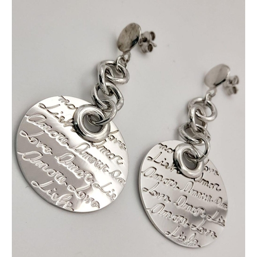 1066 - A STERLING SILVER DROP EARRINGS WITH THE WORD LOVE ENGRAVED IN MANY LANGUAGES 10.5G. Ref: H 5004