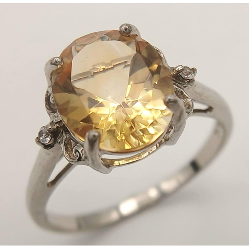 1140 - A Sterling Silver Citrine and White Sapphire Set Ring Size T. The Ring is set with a 1.2cm Long Oval... 