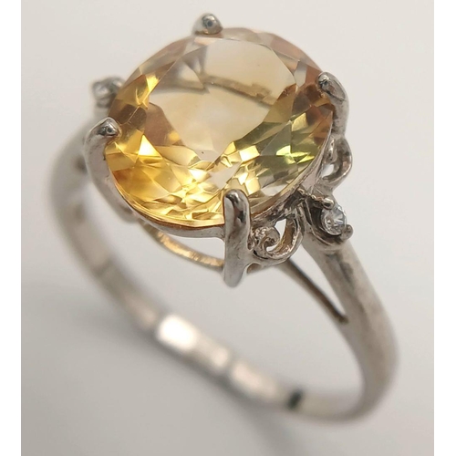 1140 - A Sterling Silver Citrine and White Sapphire Set Ring Size T. The Ring is set with a 1.2cm Long Oval... 