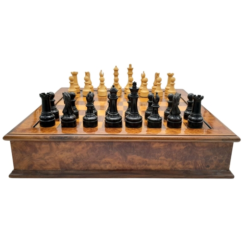 1157 - A SOLID MAPLE WALNUT CHESS BOARD WITH DRAWERS EITHER SIDE AND CARVED WOODEN WEIGHTED CHESS PIECES , ... 