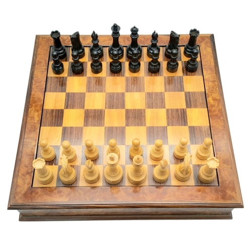 1157 - A SOLID MAPLE WALNUT CHESS BOARD WITH DRAWERS EITHER SIDE AND CARVED WOODEN WEIGHTED CHESS PIECES , ... 