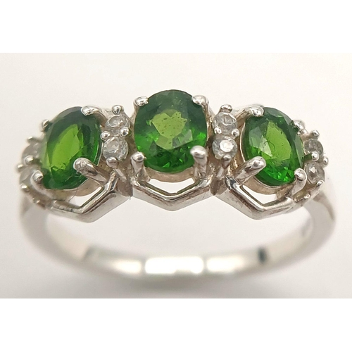 1189 - A Sterling Silver Diopside and White Sapphire Set Ring Size O. Set with Three 6mm Long Oval Cut Gree... 