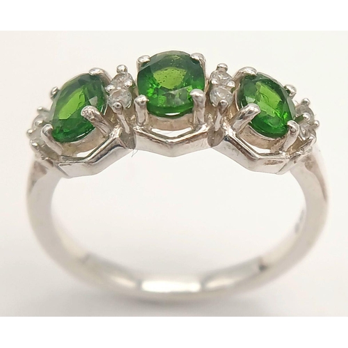 1189 - A Sterling Silver Diopside and White Sapphire Set Ring Size O. Set with Three 6mm Long Oval Cut Gree... 