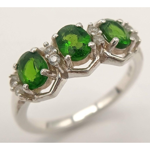 1189 - A Sterling Silver Diopside and White Sapphire Set Ring Size O. Set with Three 6mm Long Oval Cut Gree... 