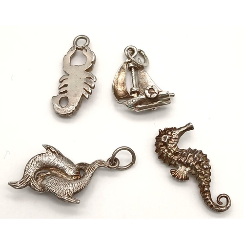 1192 - A 4 X STERLING SILVER WATER THEMED CHARMS CRAB, SAILING BOAT, SEAHORSE & LOVE FISH 8.8G. Ref: H 5014