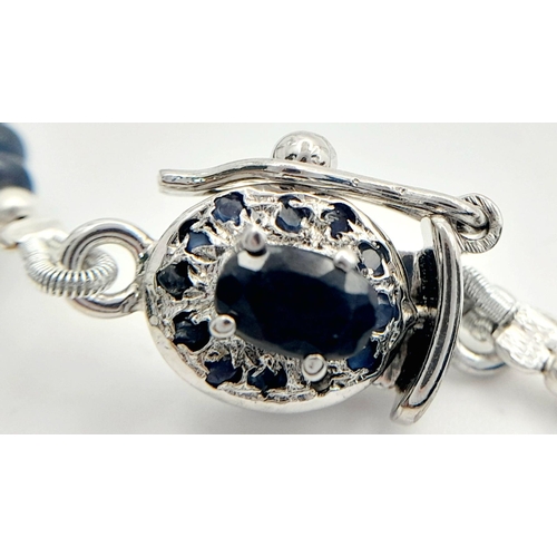 1202 - A 925 silver single strand necklace with 110ct cabochon blue sapphire gemstones and silver clasp. Re... 