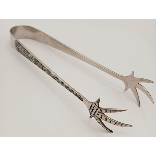 1235 - A stunning sterling silver Eagle claws sugar tons with fabulous engravings. Total weight 28.6G. Tota... 