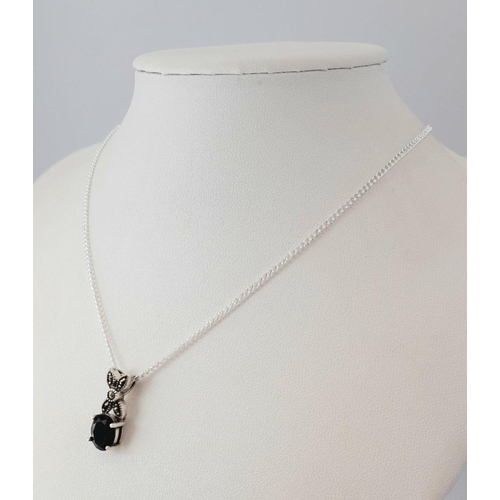 1583 - A sterling silver necklace with a sapphire set drop pendant. Approx 50cm in length with a pendant si... 