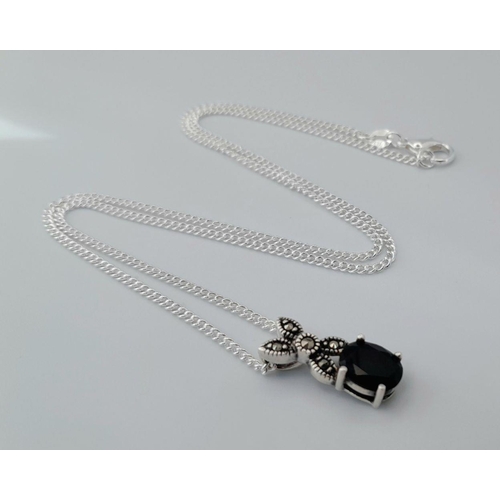 1583 - A sterling silver necklace with a sapphire set drop pendant. Approx 50cm in length with a pendant si... 