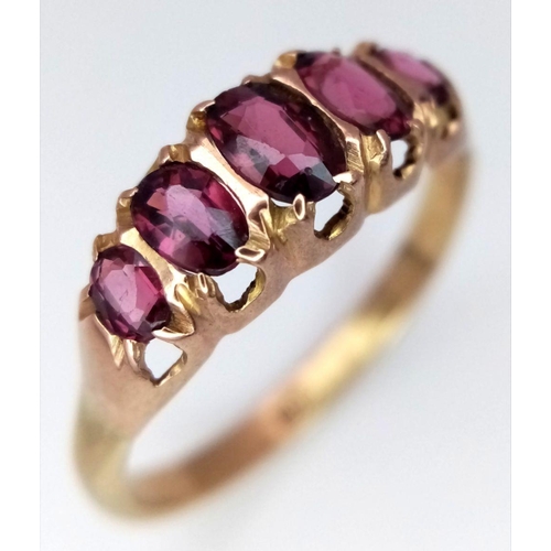 553 - Impressive 9 carat GOLD and GARNET RING. Consisting a sweep of  5 x OVAL CUT GARNETS mounted to top ... 