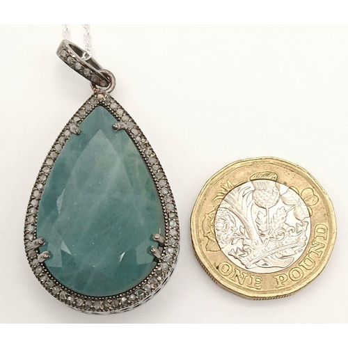 607 - A 925 silver pendant with a 31.35ct aquamarine gemstone and 0.70ct diamond accents ON SILVER CHAIN. ... 