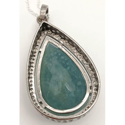 607 - A 925 silver pendant with a 31.35ct aquamarine gemstone and 0.70ct diamond accents ON SILVER CHAIN. ... 