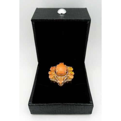 628 - A 925 silver ring with an Ethiopian fire opal and diamond accents, set in a sunburst design. Opal ap... 