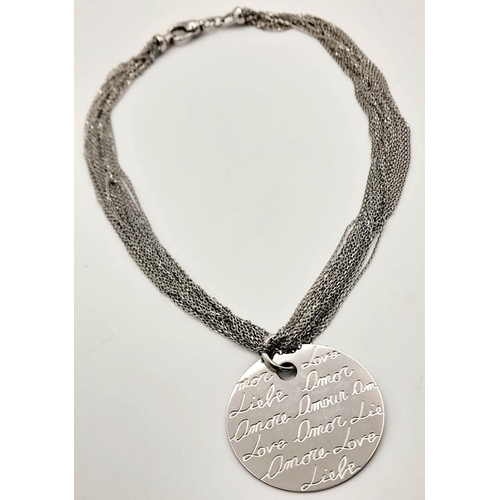 655 - A STERLING SILVER MULTI STRAND NECKLACE WITH PENDANT ENGRAVED WITH THE WORD LOVE IN MANY LANGUAGES 3... 