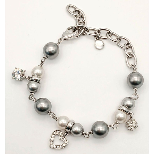 658 - Original OLIVER WEBER BRACELET. Set with SWAROVSKI CRYSTAL CHARMS. Complete with original jewellers ... 