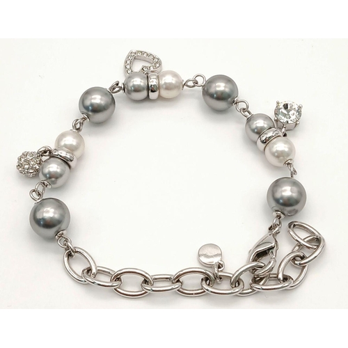 658 - Original OLIVER WEBER BRACELET. Set with SWAROVSKI CRYSTAL CHARMS. Complete with original jewellers ... 