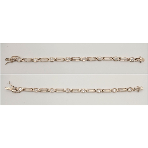 767 - A Vintage Sterling Silver Clear Quartz Set Tennis Bracelet. 18cm Length. Set with Eight 6mm Oval Cut... 