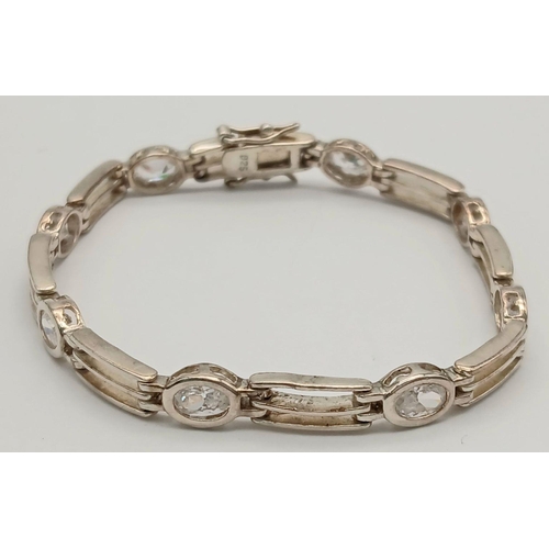 767 - A Vintage Sterling Silver Clear Quartz Set Tennis Bracelet. 18cm Length. Set with Eight 6mm Oval Cut... 