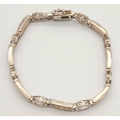 767 - A Vintage Sterling Silver Clear Quartz Set Tennis Bracelet. 18cm Length. Set with Eight 6mm Oval Cut... 