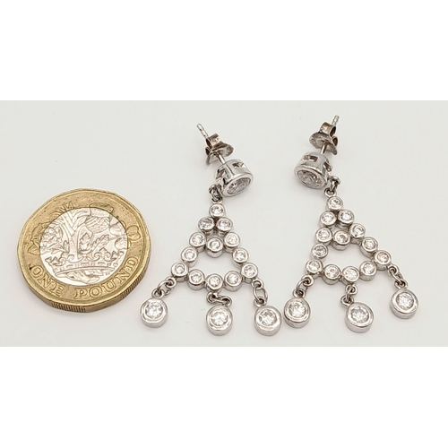 770 - Impressive pair of SILVER and ZIRCONIA DROP EARRINGS. Complete with jewellers earring case. Please s... 