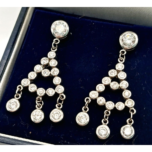 770 - Impressive pair of SILVER and ZIRCONIA DROP EARRINGS. Complete with jewellers earring case. Please s... 