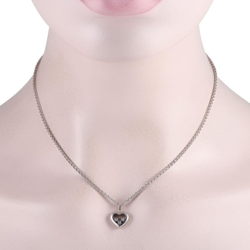 448 - A Chopard Happy Diamond 18K White Gold Diamond Heart Necklace. It features a heart-shaped white gold... 