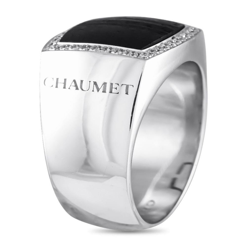 531 - A Chaumet 18K White Gold 0.20ct Diamond and Wood GENTS Ring. This chunky ring in white gold features... 