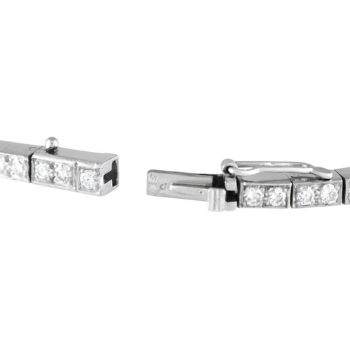 596 - Withdrawn - A Platinum 4.35ct Diamond Bracelet. Made with a sleek platinum setting, this piece measu... 