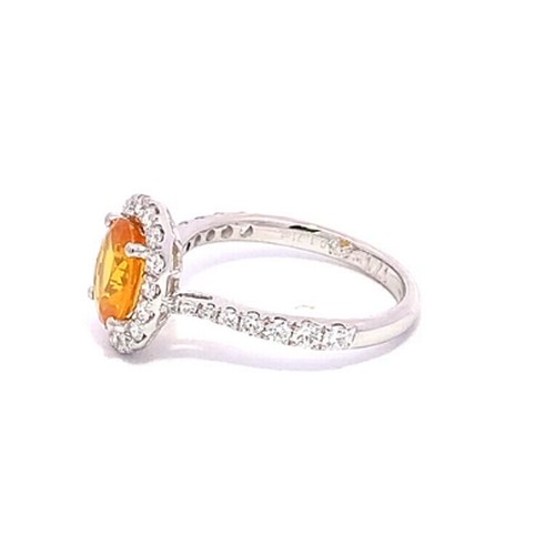 569 - A Platinum YELLOW SAPPHIRE and DIAMOND Cluster Ring. 1.71ct claw set oval shape Yellow Sapphire cent... 