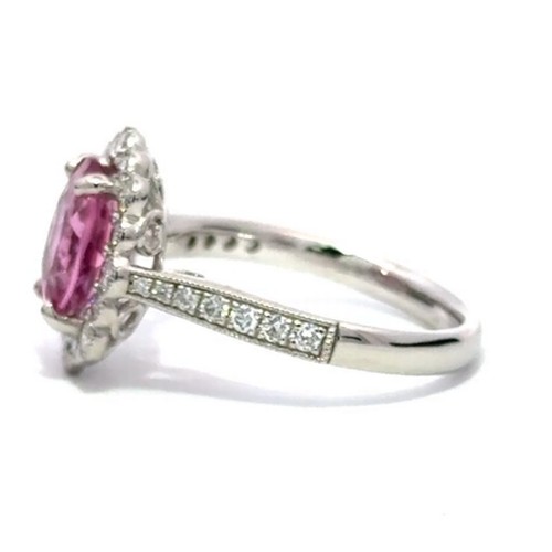 583 - A Platinum PINK TOURMALINE and DIAMOND Cluster Ring. 2.32ct claw set oval shape Pink Tourmaline cent... 