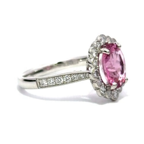 583 - A Platinum PINK TOURMALINE and DIAMOND Cluster Ring. 2.32ct claw set oval shape Pink Tourmaline cent... 