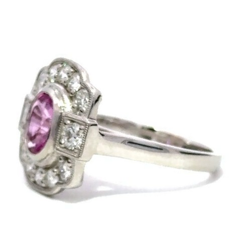 645 - A Platinum PINK SAPPHIRE and DIAMOND Cluster Ring. 1.37ct claw set oval shape Pink Sapphire centre, ... 