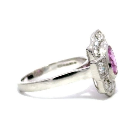 645 - A Platinum PINK SAPPHIRE and DIAMOND Cluster Ring. 1.37ct claw set oval shape Pink Sapphire centre, ... 