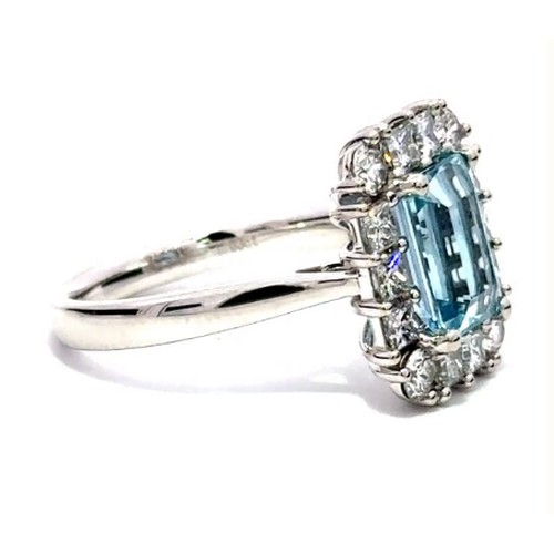 680 - A Platinum AQUA and DIAMOND Cluster Ring. 1.91ct claw set oval shape Aqua centre, decorated with 0.7... 