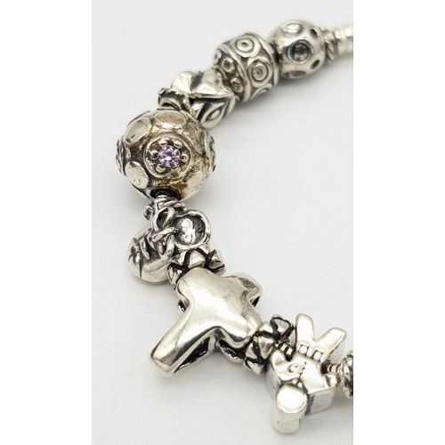 1098 - A Sterling Silver Charm Bracelet. 19cm Length. Gross Weight 42.36 Grams.