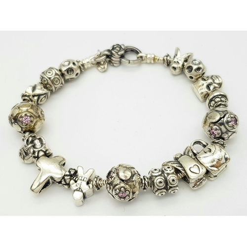 1098 - A Sterling Silver Charm Bracelet. 19cm Length. Gross Weight 42.36 Grams.