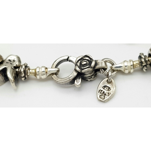 1098 - A Sterling Silver Charm Bracelet. 19cm Length. Gross Weight 42.36 Grams.