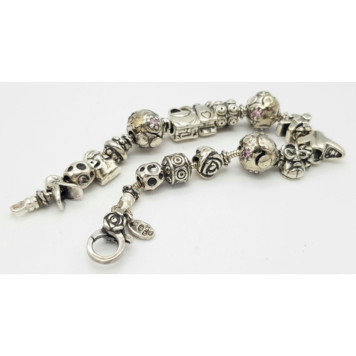 1098 - A Sterling Silver Charm Bracelet. 19cm Length. Gross Weight 42.36 Grams.