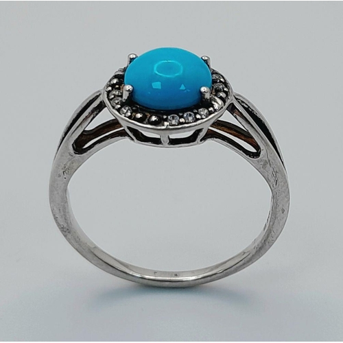 1147 - A Sterling Silver Turquoise and White Topaz Set Ring Size O. Set with an 8mm Round Cut Turquoise Cab... 