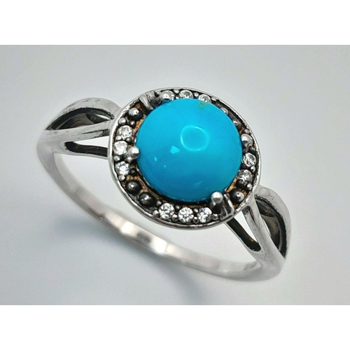 1147 - A Sterling Silver Turquoise and White Topaz Set Ring Size O. Set with an 8mm Round Cut Turquoise Cab... 