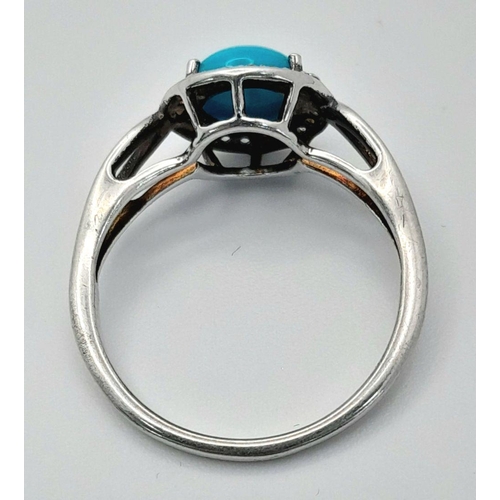 1147 - A Sterling Silver Turquoise and White Topaz Set Ring Size O. Set with an 8mm Round Cut Turquoise Cab... 