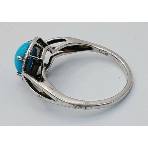 1147 - A Sterling Silver Turquoise and White Topaz Set Ring Size O. Set with an 8mm Round Cut Turquoise Cab... 