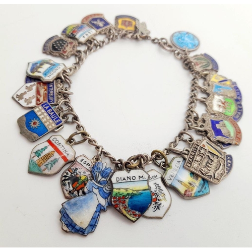 1425 - A vintage sterling silver Enamel  travel multi-charms bracelet. Silver hallmarks on each charms. Tot... 