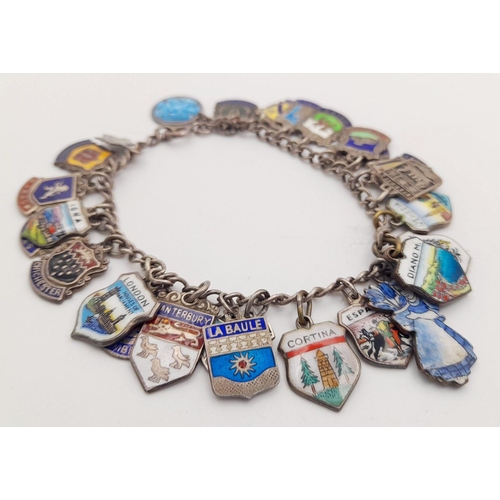 1425 - A vintage sterling silver Enamel  travel multi-charms bracelet. Silver hallmarks on each charms. Tot... 