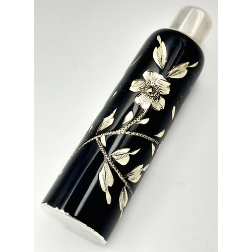 1479 - A stunning 925 silver perfume bottle with Enamel floral motif. Total weight 13.9G. Height 6.2cm.