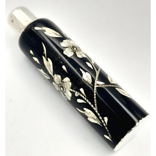 1479 - A stunning 925 silver perfume bottle with Enamel floral motif. Total weight 13.9G. Height 6.2cm.