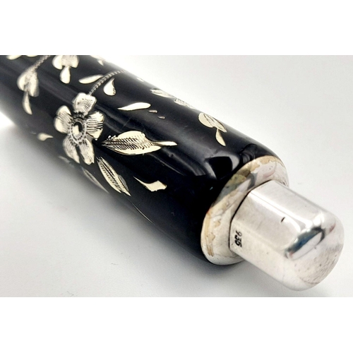 1479 - A stunning 925 silver perfume bottle with Enamel floral motif. Total weight 13.9G. Height 6.2cm.