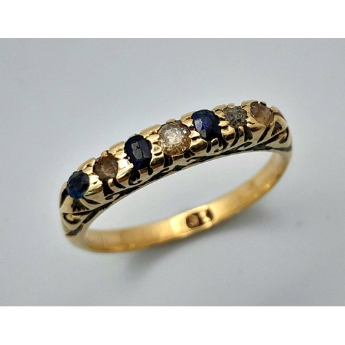 1653 - An 18K Gold Blue and White Stone Ring. Size M. 2.45g total weight.